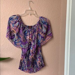 Colorful peacock patterned blouse.
